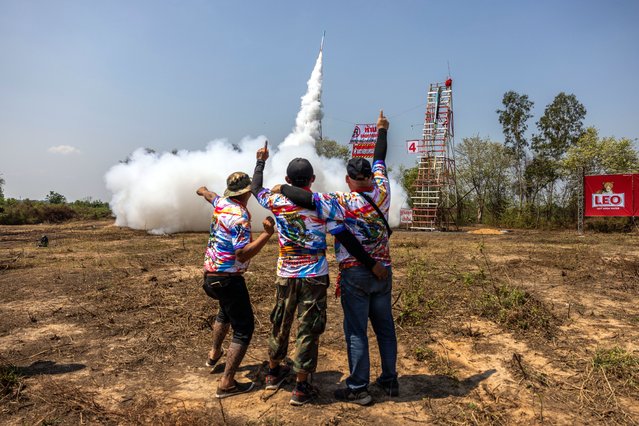 Participants launch home-made rockets during the “Bun Bang Fai” rocket festival on May 12, 2024 in Yasothon, Thailand. The rocket festival, known locally as “Bun Bang Fai” in Yasothon, Thailand, is an annual celebration in the northeastern Isaan region where villagers launch homemade rockets, crafted from bamboo and PVC pipe, into the sky as a plea to the gods for rain before the rice-growing season. (Photo by Lauren DeCicca/Getty Images)