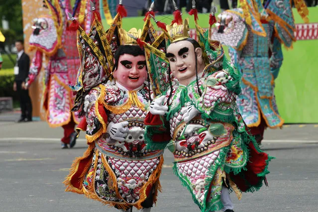 Dancers dressed as Chinese gods perform during the inauguration ceremony of Taiwan's President Tsai Ing-wen in Taipei, Taiwan, Friday, May 20, 2016. (Photo by Chiang Ying-ying/AP Photo)