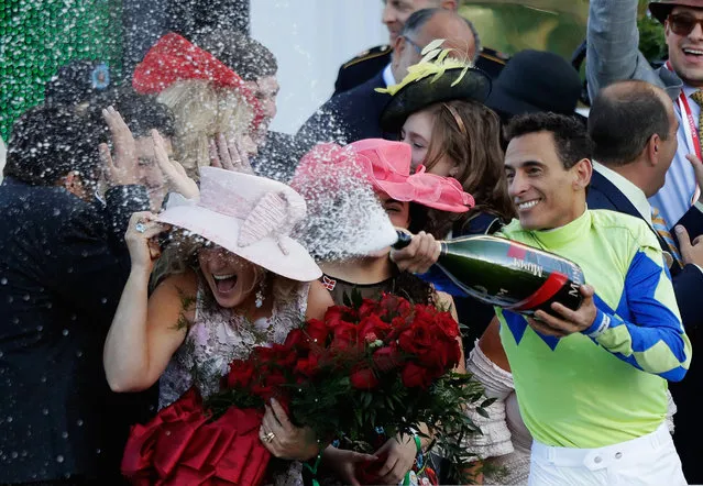 Jockey John Velazquez sprays champagne in the winner's circle after guiding Always Dreaming to win the 143rd running of the Kentucky Derby at Churchill Downs on May 6, 2017 in Louisville, Kentucky. (Photo by Andy Lyons/Getty Images)