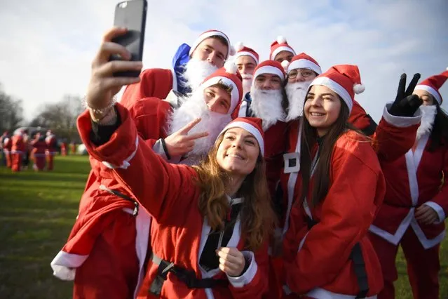 Participants during the London Santa Run in Victoria Park, London on December 8, 2019, where over 4,000 santas are expected to take part. (Photo by Victoria Jones/PA Images via Getty Images)
