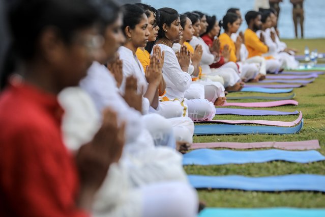 Yoga enthusiasts participate in a yoga session organized by the High Commission of India to mark the International Day of Yoga at the Galle Face seafront in Colombo, Sri Lanka, 22 June 2024. International Day of Yoga is celebrated annually on 21 June, and has been recognized worldwide since 2015. The United Nations declared Yoga a practice of physical, mental, and spiritual exercise originating in ancient India. This year marked the 10th anniversary of the annual event, and the theme is “Yoga for Self and Society”. (Photo by Chamila Karunarathne/EPA)