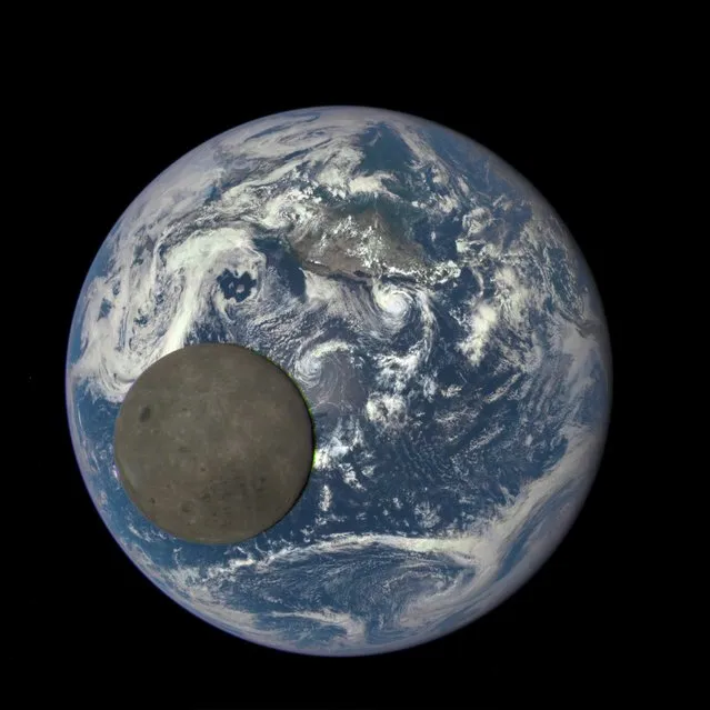 The far side of the moon, illuminated by the sun, as it crosses between the DSCOVR spacecraft's Earth Polychromatic Imaging Camera (EPIC) camera and telescope, and the Earth – one million miles away. (Photo by NASA/NOAA)