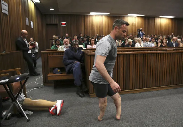 Oscar Pistorius' prosthetics lay on the floor as he walks on his stumps during argument in mitigation of sentence by his defense attorney Barry Roux in the High Court in Pretoria, South Africa, Wednesday, June 15, 2016. An appeals court found Pistorius guilty of murder and not a lesser charge of culpable homicide for the shooting death of his girlfriend Reeva Steenkamp. (Photo by Siphiwe Sibeko, Pool Photo via AP Photo)