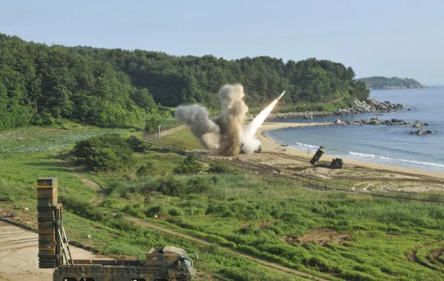 In this photo provided by Eighth U.S. Army, a U.S. MGM-140 Army Tactical Missile is fired into the east sea during the combined military exercise against North Korea at an undisclosed location in South Korea, Wednesday, July 5, 2017. North Korea delighted in the international furor created by its first launch of an intercontinental ballistic missile, vowing Wednesday to never give up its missiles or nuclear weapons and to keep sending Washington more "gift packages" of weapons tests. U.S. and South Korean forces, in response, engineered what was meant as a show of force for Pyongyang, with soldiers from the allied nations firing “deep strike” precision missiles into South Korean territorial waters. The missile firings Tuesday demonstrated U.S.-South Korean solidarity, the U.S. Eighth Army said in a statement. (Photo by Eighth U.S. Army via AP Photo)