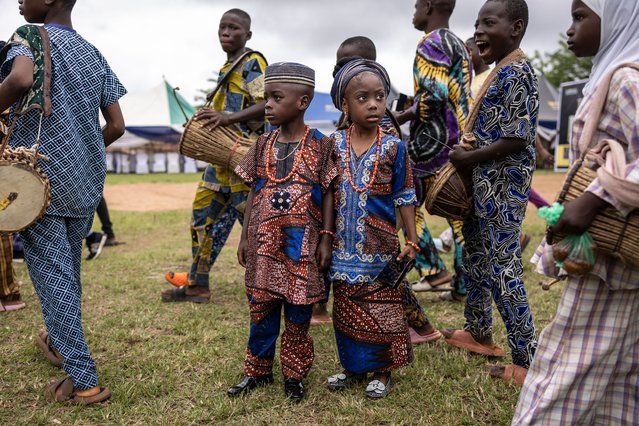 Twins look on as they attend the Igboora World Twins Festival 2024, in Igbo-Ora, Nigeria on October 12, 2024. (Photo by Olympia de Maismont/AFP Photo)