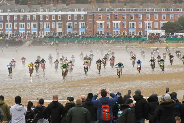 Over three hundred riders watched by thousands of spectators take part in the 40th Weymouth Beach Motocross race over a makeshift course carved out of the resort's golden sand by diggers in Weymouth, Dorset, UK on October 20, 2024. The annual free event is run by the Purbeck Motocross Club. (Photo by Graham Hunt/Alamy Live News)