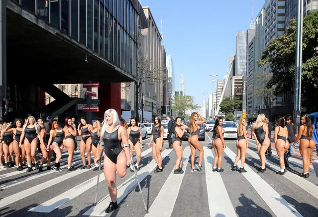 Miss BumBum Brazil 2017 pageant contestants pose at Paulista Avenue in Sao Paulo's financial centre, Brazil, August 7, 2017. (Photo by Paulo Whitaker/Reuters)