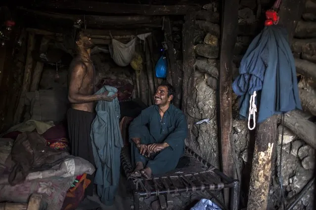 Miners rest in their rooms at the end of the day at a coal field in Choa Saidan Shah, Punjab province, April 29, 2014. (Photo by Sara Farid/Reuters)