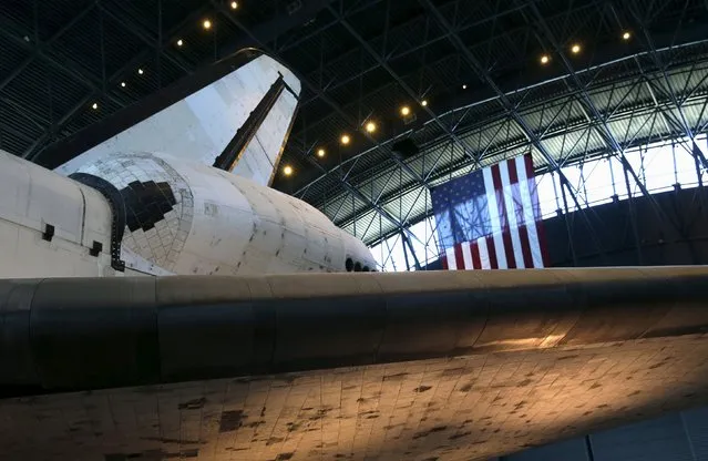 The fuselage, and heat tiles (bottom), under the wing of the space shuttle orbiter Discovery are seen on display at the Udvar-Hazy Smithsonian National Air and Space Annex Museum in Chantilly, Virginia August 28, 2015. (Photo by Gary Cameron/Reuters)