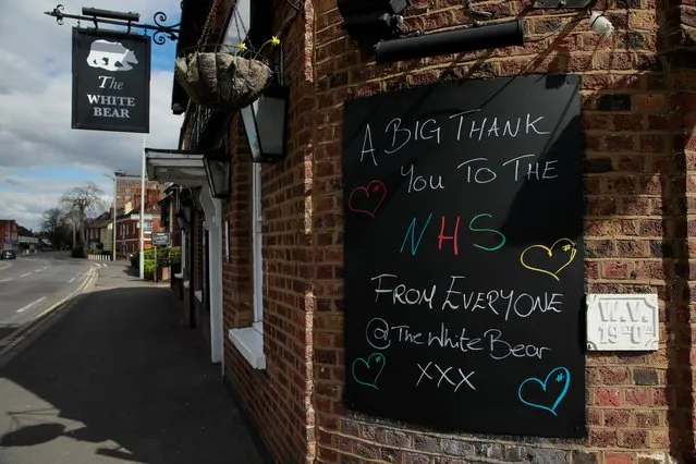 A thank you sign for the NHS is seen outsibe a pub as the spread of the coronavirus disease (COVID-19) continues, Broxbourne, Britain, March 31, 2020. (Photo by Andrew Couldridge/Reuters)