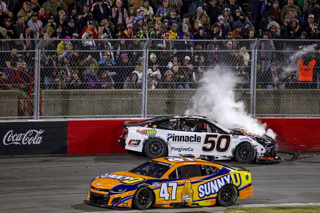 Smoke is seen as Burt Myers, driver of the #50 Citrusafe Cleaners Chevrolet sits parked after an on-track incident with Ricky Stenhouse Jr., driver of the #47 SUNNYD Chevrolet during the Last Chance Qualifier race for the Cook Out Clash at Bowman Gray Stadium on February 02, 2025 in Winston Salem, North Carolina. (Photo by Sean Gardner/Getty Images)