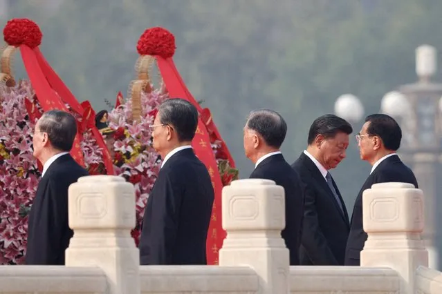 Chinese leaders, including Premier Li Keqiang, led by President Xi Jinping, lay wreaths on Tiananmen Square to mark Martyrs' Day on the eve of the National Day in Beijing, China on September 30, 2022. (Photo by Thomas Peter/Reuters)