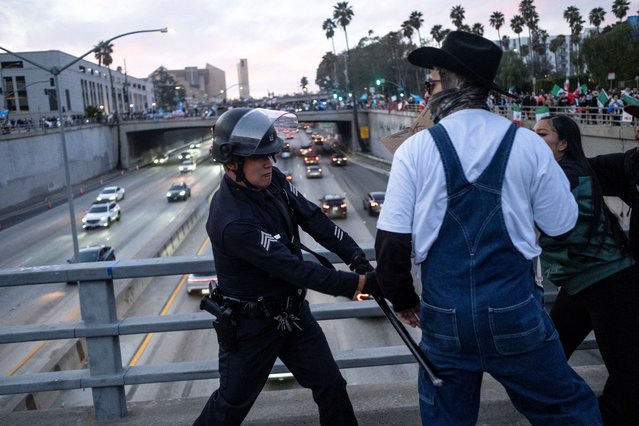 Police officers clash with protestors during a rally against arrests and deportations of migrants by U.S. government agencies in Los Angeles, California, U.S. February 2, 2025. (Photo by Joel Angel Juarez/Reuters)
