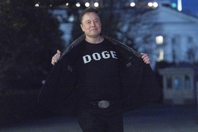 Elon Musk flashes his t-shirt that reads “DOGE” to the media as he walks on South Lawn of the White House, in Washington, Sunday, March 9, 2025. (Photo by Jose Luis Magana/AP Photo)