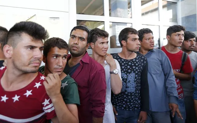Migrants queue to buy train ticket at the station in Beli Manastir, Croatia September 18, 2015. (Photo by Laszlo Balogh/Reuters)