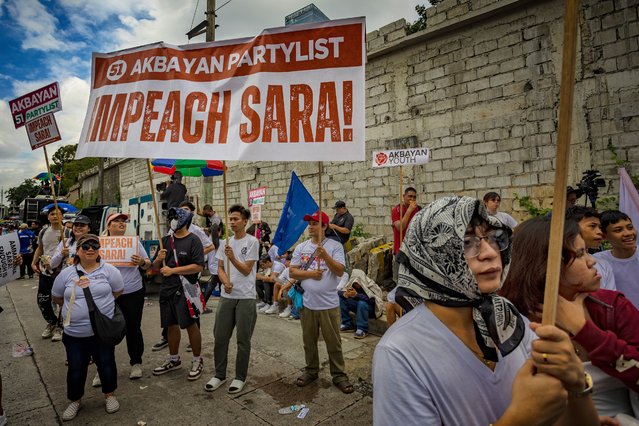 Demonstrators take part in a protest calling for the impeachment of Vice President Sara Duterte at the People Power Monument on January 31, 2025 in Quezon city, Metro Manila, Philippines. Vice President Sara Duterte is facing possible impeachment following her statements that she had contracted an assassin to kill President Ferdinand Marcos Jr., his wife, and the House Speaker if she were killed. The shocking claim has intensified a bitter feud between their once-allied families, with Congress also investigating Duterte for alleged misuse of public funds. (Photo by Ezra Acayan/Getty Images)