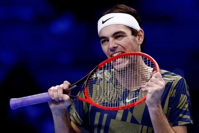 Taylor Fritz of United States bites his racquet while playing Casper Ruud of Norway during round robin play on Day Three of the Nitto ATP Finals at Pala Alpitour on November 15, 2022 in Turin, Italy. (Photo by Guglielmo Mangiapane/Reuters)