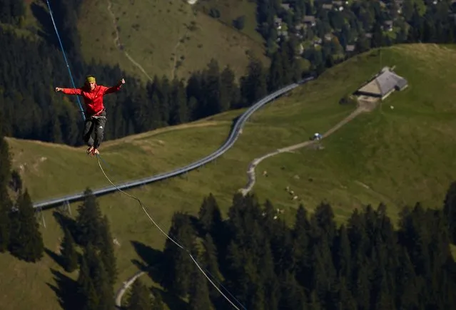 Friedi Kuehni of Germany walks on the line during the Highline Extreme event in Moleson, Switzerland September 25, 2015. (Photo by Denis Balibouse/Reuters)