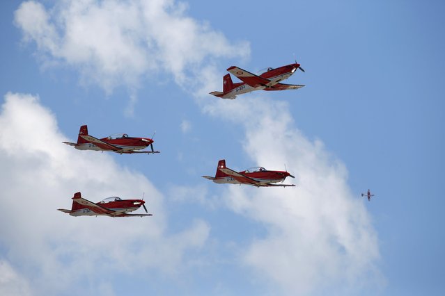 The Swiss Air Force PC-7 Team, flying Pilatus PC-7 Turbo Trainer aircraft, take part in a display during the Malta International Airshow at Malta International Airport, outside Valletta, Malta, September 27, 2015. (Photo by Darrin Zammit Lupi/Reuters)