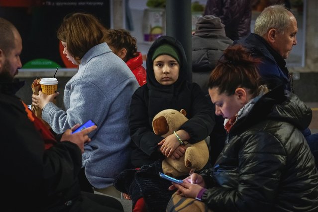 A child holds a toy while taking shelter with parents inside a metro station during a Russian military strike, amid Russia's attack on Ukraine, in Kyiv, Ukraine on April 6, 2025. (Photo by Alina Smutko/Reuters)