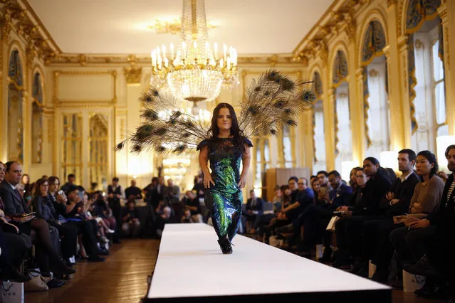 A model hits the catwalk at the French Ministry of Culture during the dwarf fashion show in Paris, France, Friday October 2, 2015. (Photo by Jerome Delay/AP Photo)