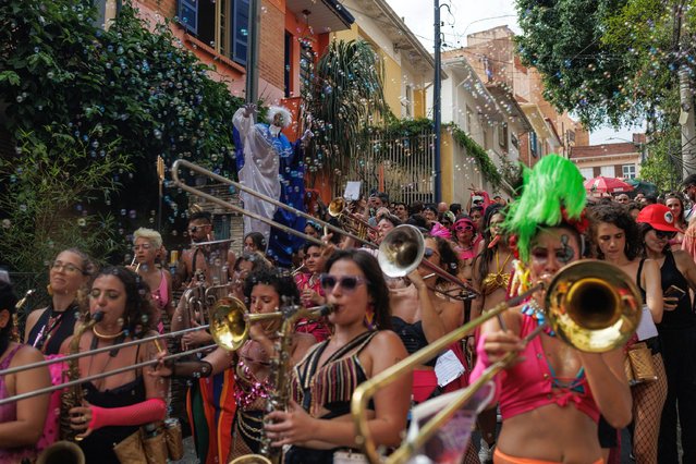 A group of people participates in a street parade called “Obscenicas”, in the center of Sao Paulo, Brazil on February17, 2024. (Photo by Isaac Fontana/EPA/EFE)
