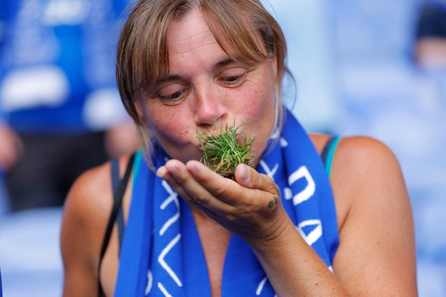 A fan kisses a piece of turf after the Premier League match between Everton FC and Southampton FC at Goodison Park on May 18, 2025 in Liverpool, United Kingdom. Photo by Tom Jenkins/The Guardian)