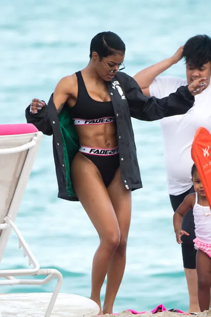 Teyana Taylor is seen with her daughter Iman Tayla Shumpert Jr. on the beach in Miami on January 1, 2018. (Photo by AM/Splash News and Pictures)