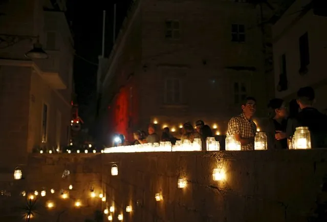 Visitors attend the activity "Birgu by Candlelight" in the medieval city of Birgu, also known as Vittoriosa, outside Valletta, Malta, October 10, 2015. (Photo by Darrin Zammit Lupi/Reuters)