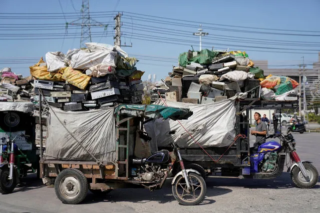 Tricycles carrying electronic waste are seen at the government-sponsored recycling park in the township of Guiyu, Guangdong Province, China January 12, 2018. Picture taken January 12, 2018. (Photo by Aly Song/Reuters)