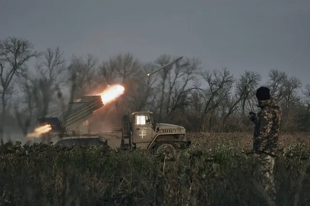 Ukrainian military's Grad multiple rocket launcher fires rockets at Russian positions in the frontline near Bakhmut, Donetsk region, Ukraine, Thursday, November 24, 2022. (Photo by LIBKOS/AP Photo)