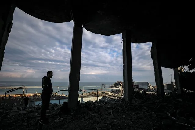A Palestinian inspects a destroyed building after an Israeli air strike in central Gaza Strip, 13 February 2023. Israel launched air strikes in the Gaza Strip early 13 February, hours after the Israeli forces said they intercepted a rocket fired from the area. (Photo by Mohammed Saber/EPA/EFE/Rex Features/Shutterstock)
