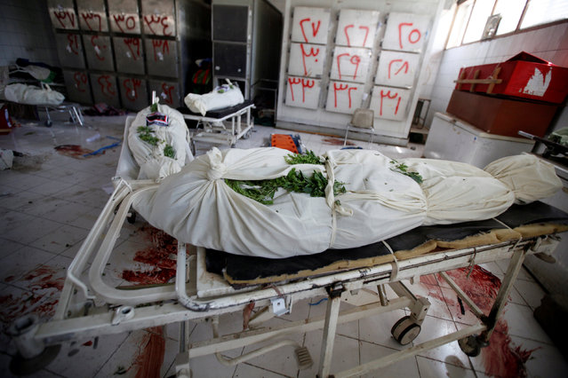 Bodies of people killed by an apparent Saudi-led air strike that ripped through a wake attended by some of Yemen's top political and security officials, are pictured at a hospital morgue in the capital Sanaa October 10, 2016. (Photo by Khaled Abdullah/Reuters)