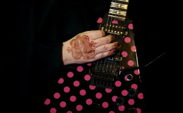 Gisele Marie, a Muslim woman and professional heavy metal musician, plays her Gibson Flying V electric guitar during a fund raising concert for Syrian refugees in Brazil, in Rio de Janeiro November 8, 2015. (Photo by Nacho Doce/Reuters)