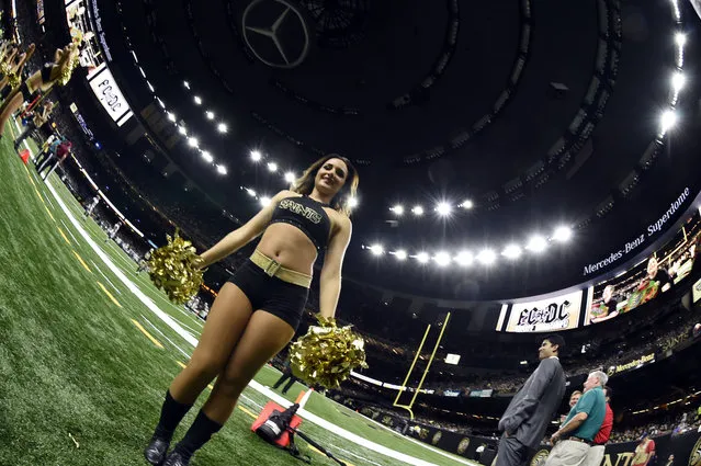 New Orleans Saints cheerleaders perform in the first half of a pre-season NFL football game against the Baltimore Ravens in New Orleans, Thursday, September 1, 2016. (Photo by Bill Feig/AP Photo)