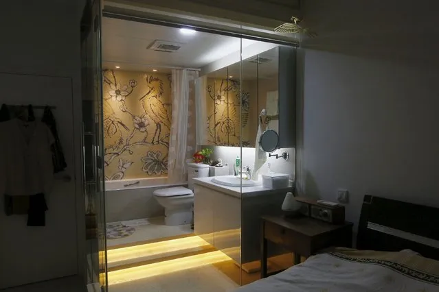 A toilet is seen inside a master bedroom at a residential flat in Hong Kong, China October 6, 2015. (Photo by Bobby Yip/Reuters)