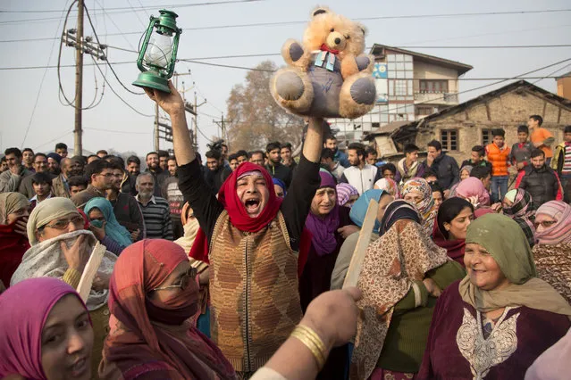 Dozens of Kashmiri residents block traffic and shout slogans against the government as they protest frequent power outages in Srinagar, Indian controlled Kashmir, Wednesday, November 18, 2015. (Photo by Dar Yasin/AP Photo)
