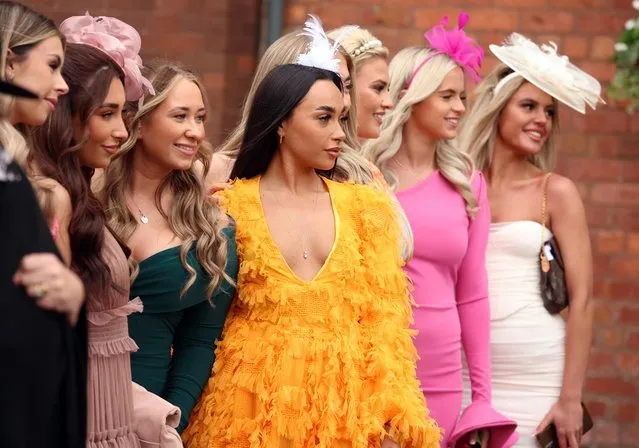 Racegoers pose on Ladies Day ahead of the races at Aintree Racecourse in Liverpool, Britain on April 14, 2023. (Photo by Phil Noble/Reuters)