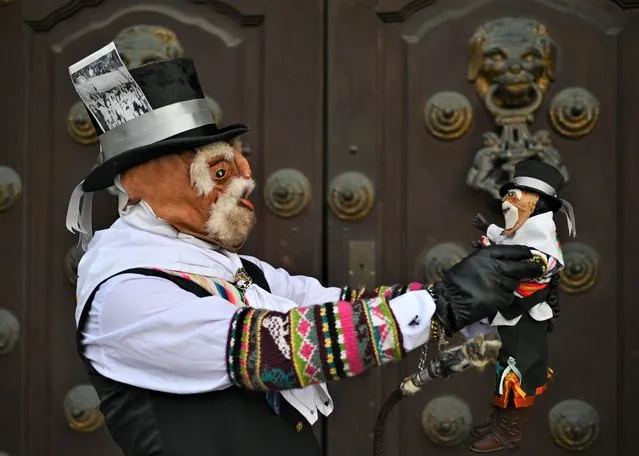 The Chuto Jaujino, a character that integrates the dance of the Tunantada, patrimony of the Nation, originally from Jauja region, poses for a photo in front of the Archbishop's Palace of Lima, in the Plaza De Armas. On Sunday, 27 March 2022, in Lima, Peru. (Photo by Artur Widak/NurPhoto via Getty Images)