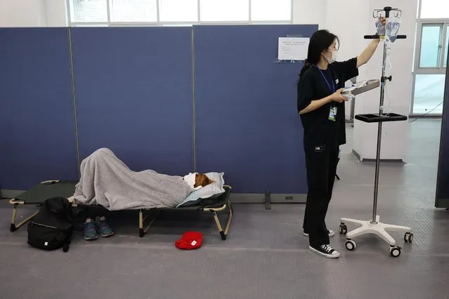 A participant receives medical treatment at Jamboree Hospital during the 25th World Scout Jamboree in Buan, South Korea on August 4, 2023. (Photo by Kim Hong-Ji/Reuters)