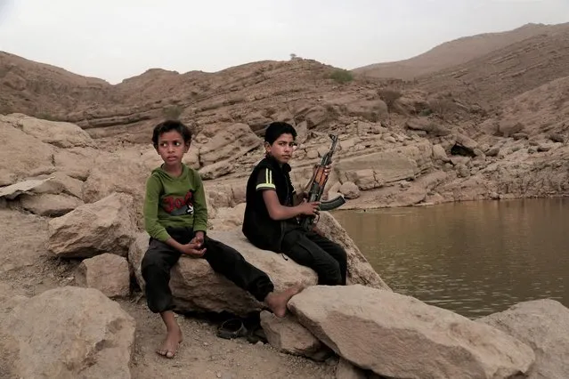 In this July 30, 2018, file photo, a 17-year-old boy holds his weapon at the dam in Marib, Yemen. The battle for the ancient desert city has become key to understanding wider tensions now inflaming the Middle East and the challenges facing any efforts by President Joe Biden’s administration to shift U.S. troops out of the region. (Photo by Nariman El-Mofty/AP Photo/File)