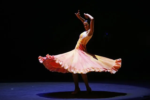 Dancers perform in the presentation of “Invocation” by the National Ballet of Spain, at the Santander Performing Arts Ensemble, in Guadalajara, Jalisco state, Mexico, 17 July 2022. After an 18-year absence, the company arrived in Mexico with various styles of Spanish dance, ending its tour at the Palacio de Bellas Artes in Mexico City. (Photo by Francisco Guasco/EPA/EFE)