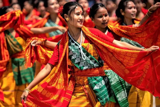 Tribal Bodo girls in traditional attire perform Sikhlai dance on Independence Day in Gauhati, northeastern Assam state, India, Monday, August 15, 2022. The country is marking the 75th anniversary of its independence from British rule. (Photo by Anupam Nath/AP Photo)