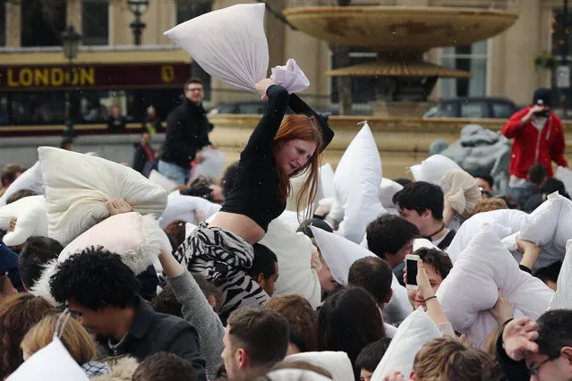 Revellers take part in a giant pillow fight in Trafalgar Square on “International Pillow Fight Day” on April 4, 2015 in London, England. (Photo by Dan Kitwood/Getty Images)