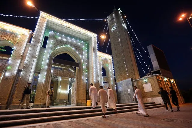 Muslims perform Eid al-Adha prayer at Abu Hanifa Mosque in Baghdad, Iraq on July 20, 2021. (Photo by Murtadha Al-Sudani/Anadolu Agency via Getty Images)