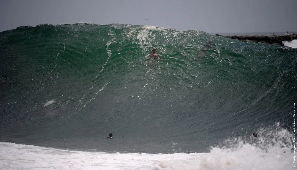 Big Waves Draw Surfers To “The Wedge” Surf Spot