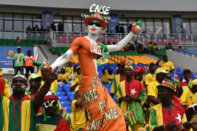 An Ivory Coast supporter dances ahead of the 2017 Africa Cup of Nations group C football match between Ivory Coast and Togo in Oyem on January 16, 2017. (Photo by Issouf Sanogo/AFP Photo)