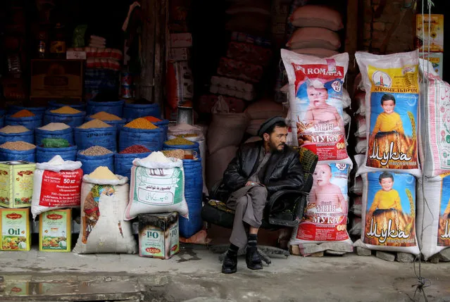 An Afghan shopkeeper wait for customers in Kabul, Afghanistan, Sunday, April, 19, 2015. (Photo by Rahmat Gul/AP Photo)