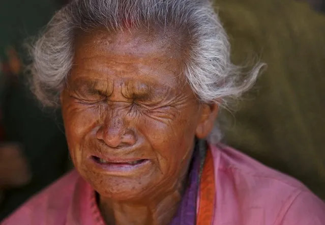 A woman mourns her granddaughter, who died in Saturday's earthquake, in Bhaktapur, Nepal April 27, 2015. (Photo by Navesh Chitrakar/Reuters)