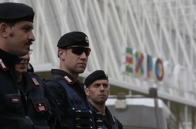 Italian Carabinieri, paramilitary police officers, patrol in front of the Expo gate during a protest against Expo 2015 in Milan, Italy, Thursday, April 30, 2015. (Photo by Antonio Calanni/AP Photo)